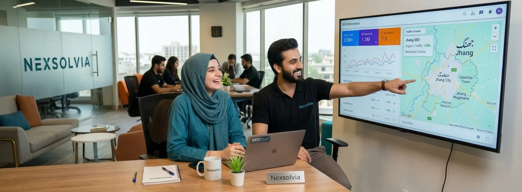 SEO services in Jhang – team analyzing local ranking graphs on 